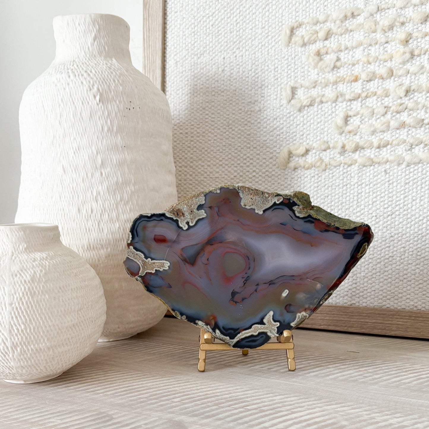 bookshelf decor, bookshelf accents, blue agate slice on brass easel stand