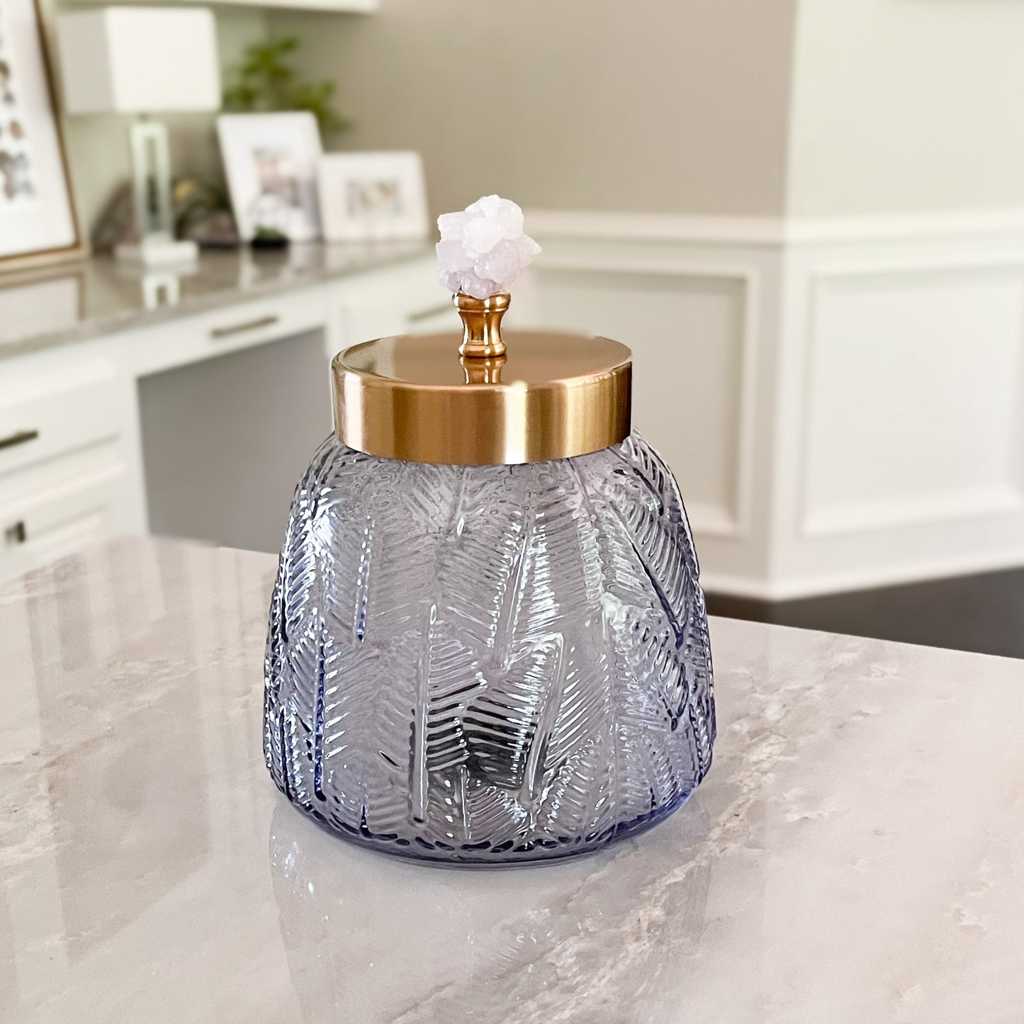 small decorative glass cansiter with brass lid and crystal handle