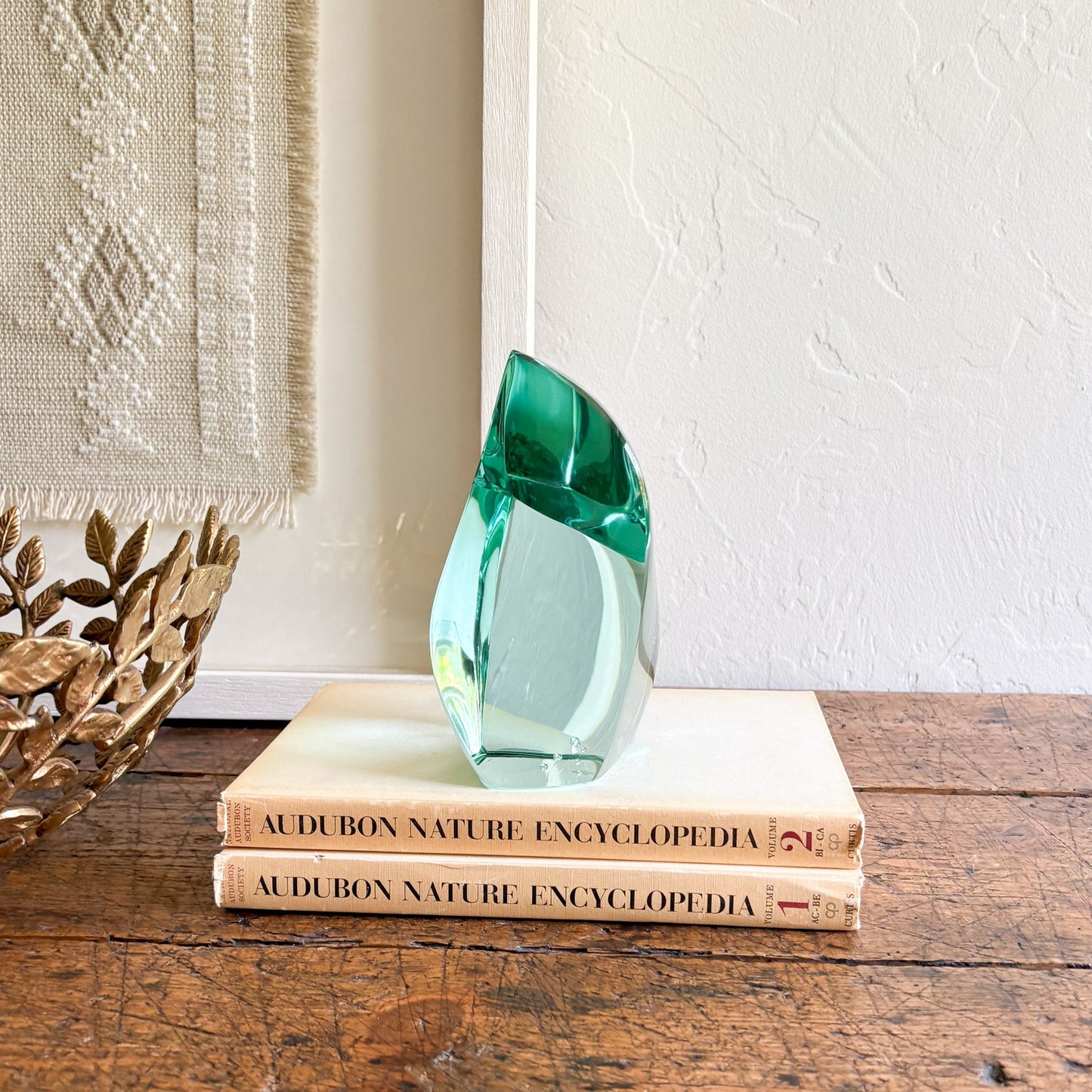 green glass bookshelf decor