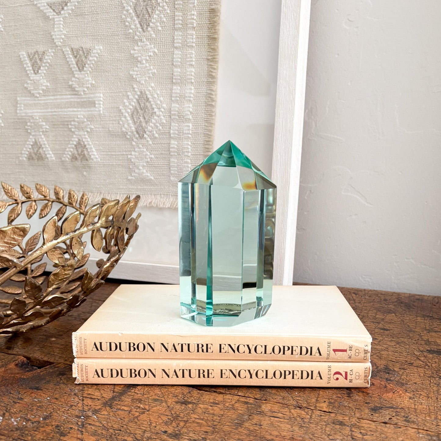 green plass point, decorative blue-green glass statue