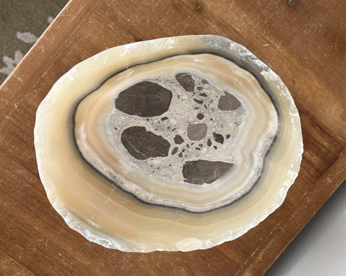 Close-up of natural grey onyx bowl highlighting intricate stone veining