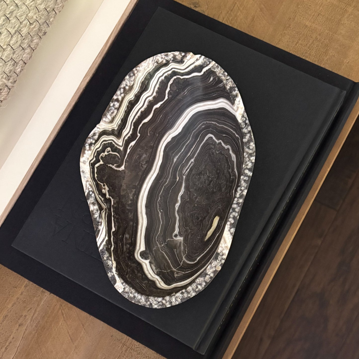 Premium hand-carved zebra onyx bowl featuring striking natural banding and polished stone texture