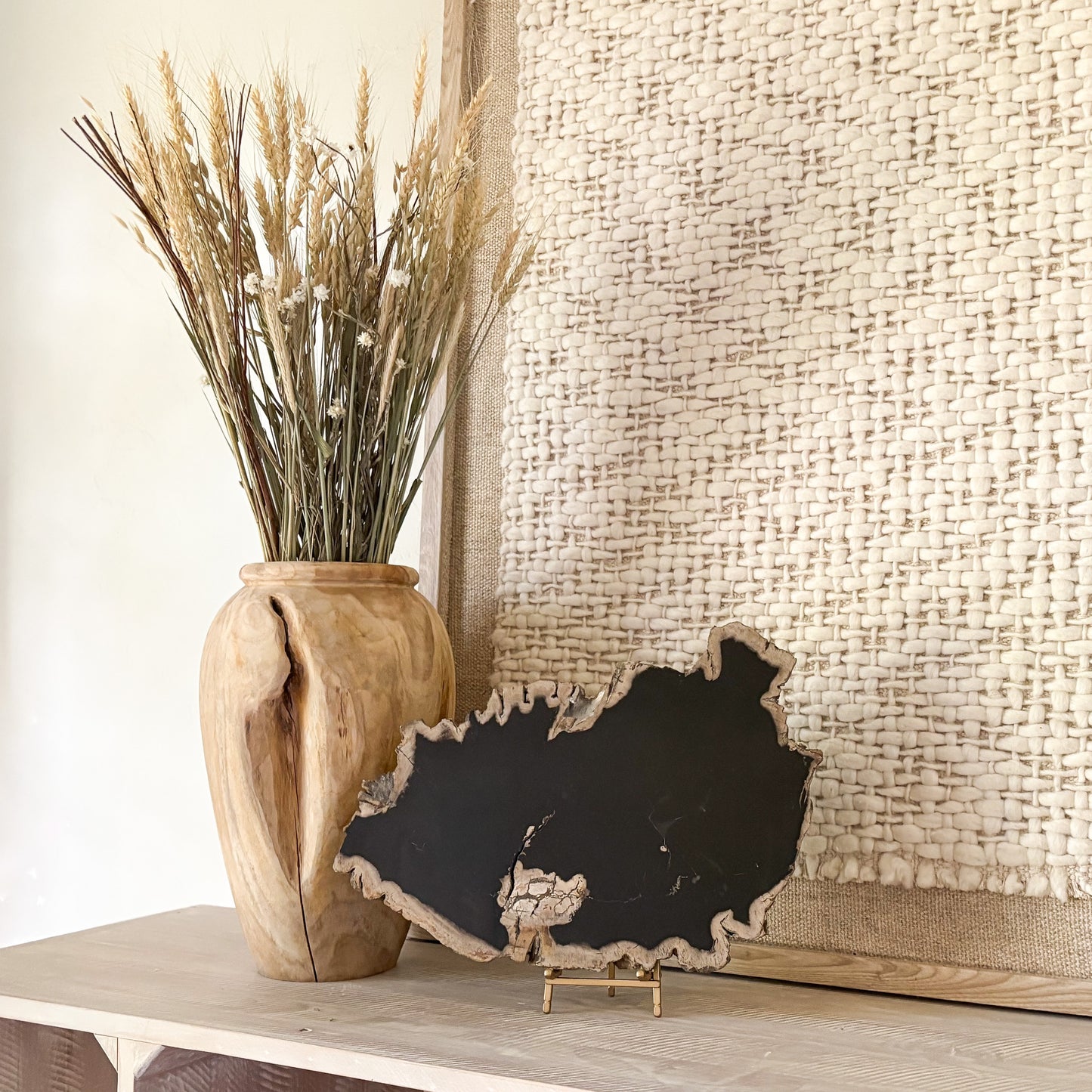 decorative black indonesian petrified wood slab on stand