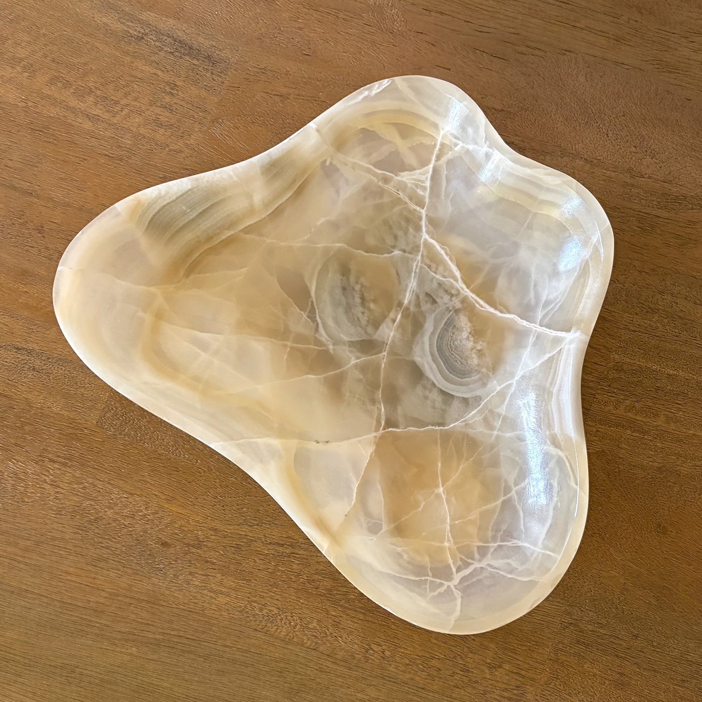 Decorative stone bowl for entryway table styling with natural amber tones
