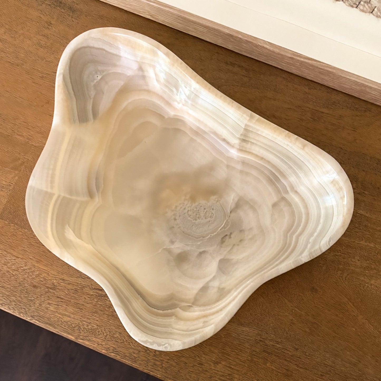 Natural grey onyx bowl hand carved by artisans, showcasing one-of-a-kind stone veining and earthy elegance.