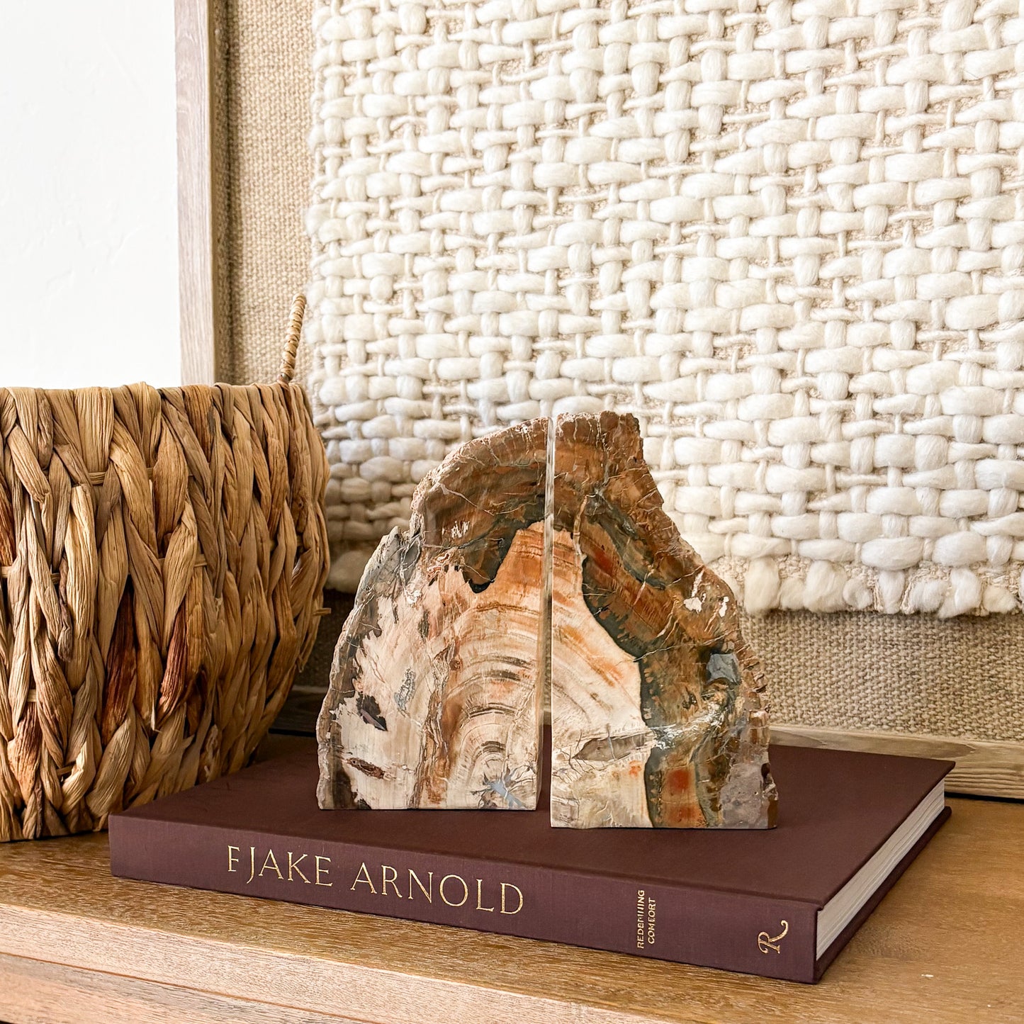 Natural Madagascar petrified wood bookend pair with polished stone face and earth tone mineral patterns