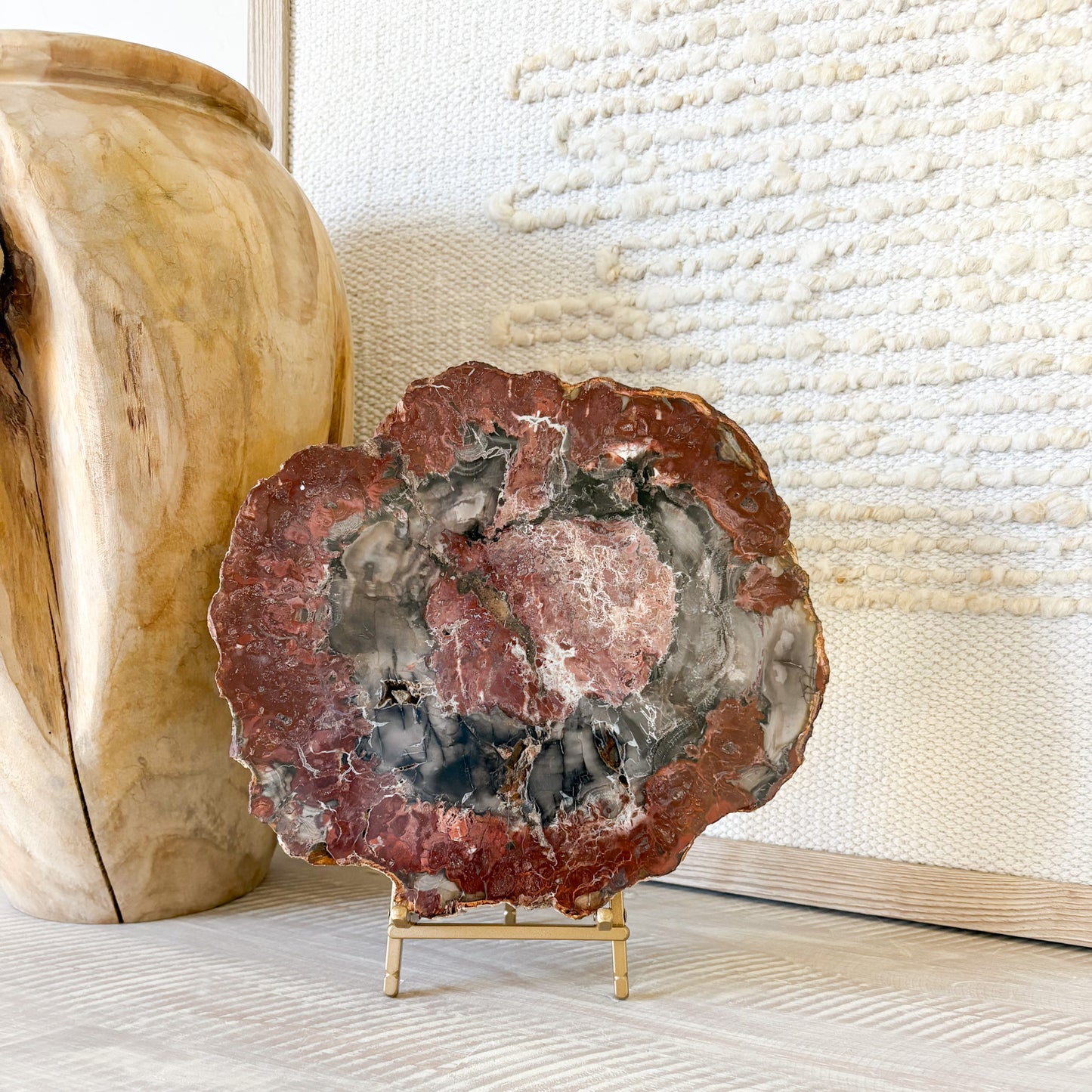 Natural fossil wood slab from Madagascar displayed on modern console