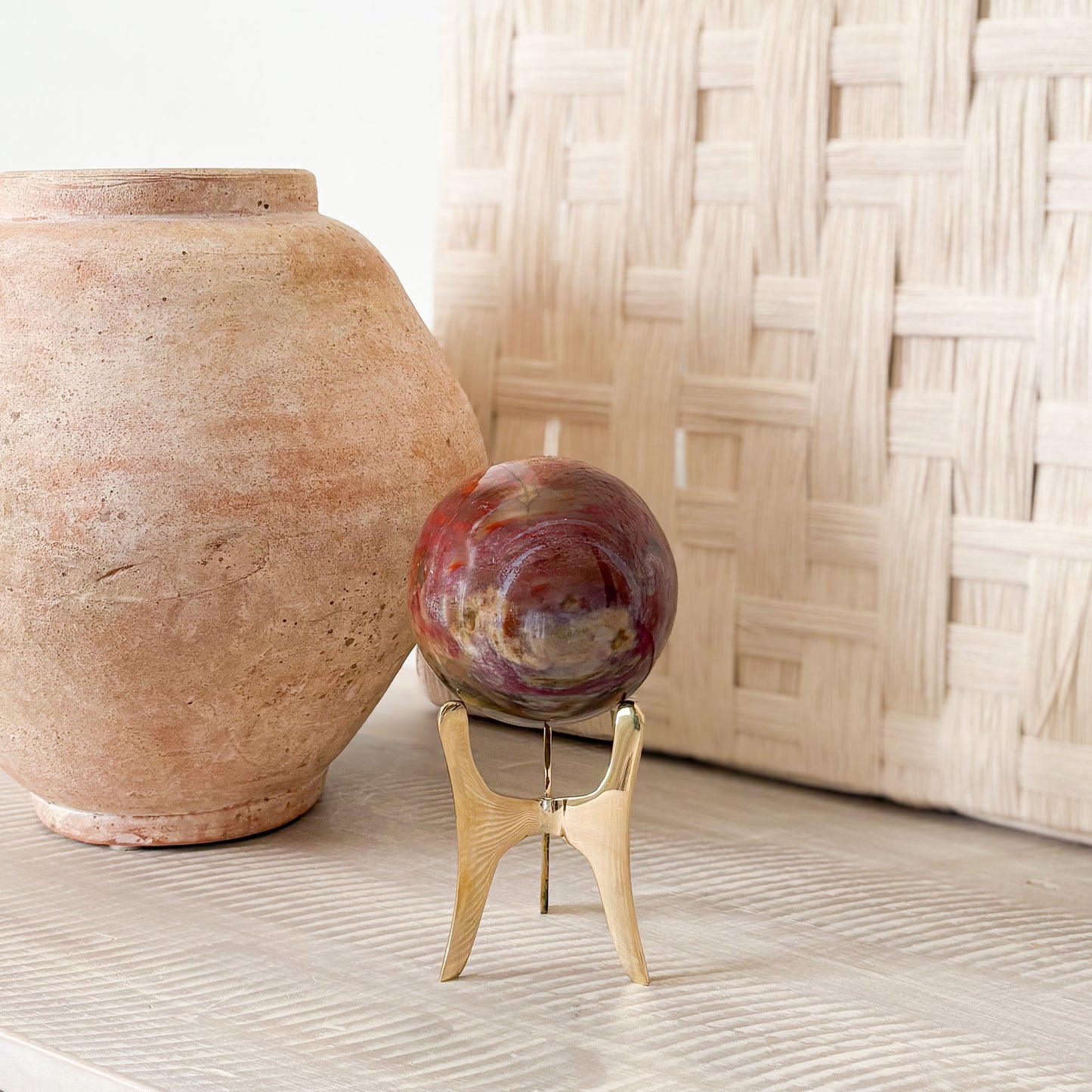 petrified wood orb on brass stand