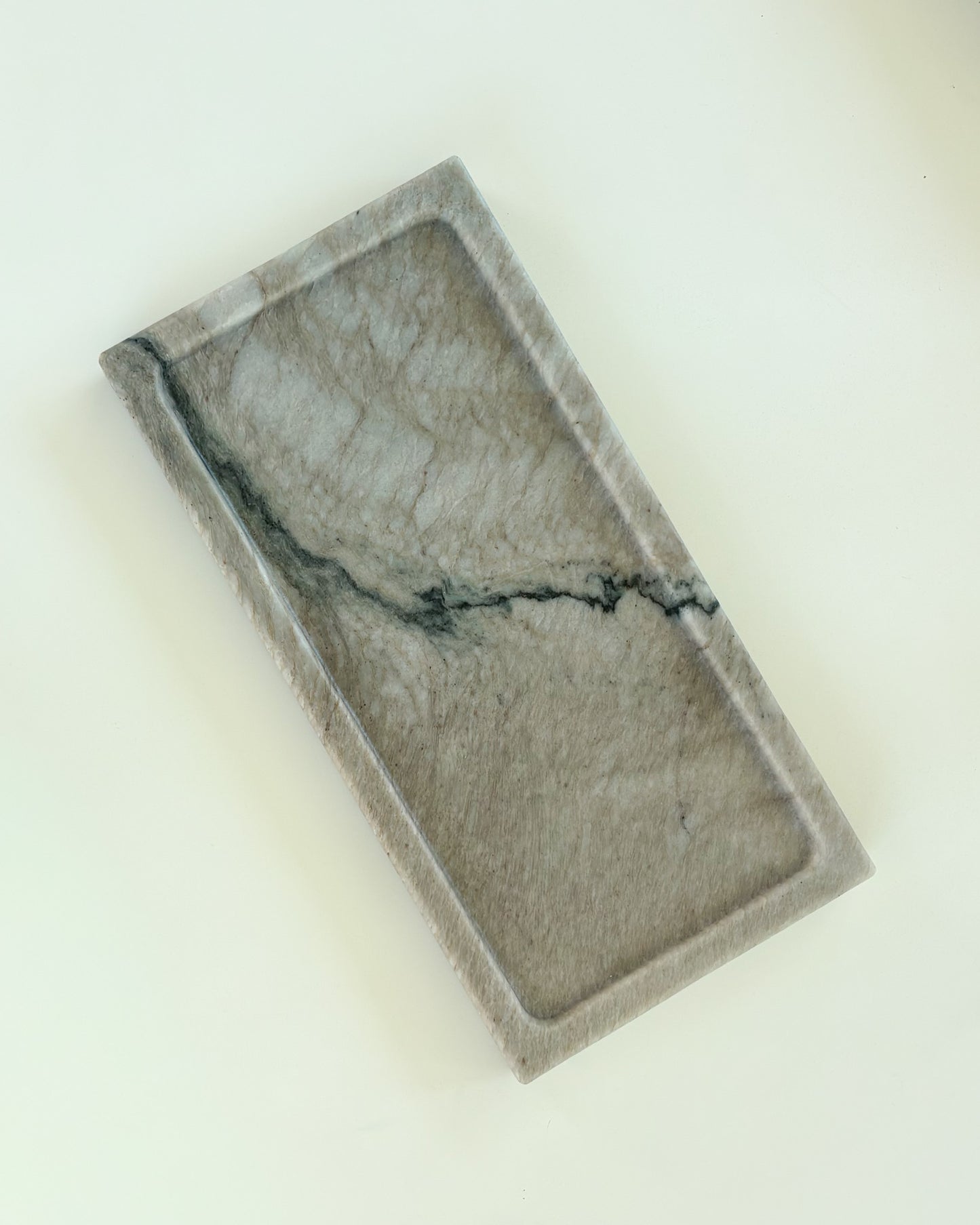 Handcrafted gray marble catchall tray with unique natural veining