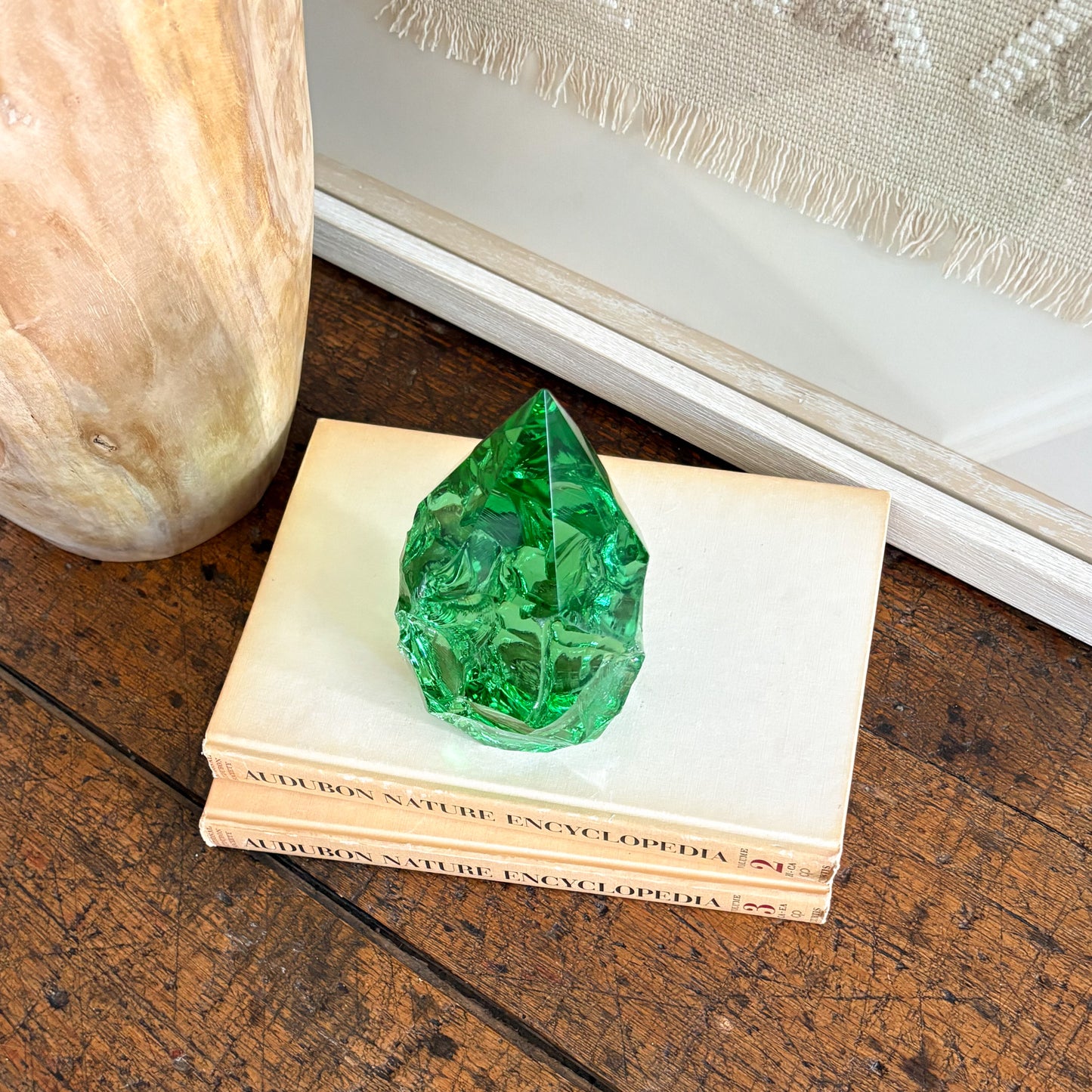 Rustic green glass crystal point styled on vintage books for shelf decor