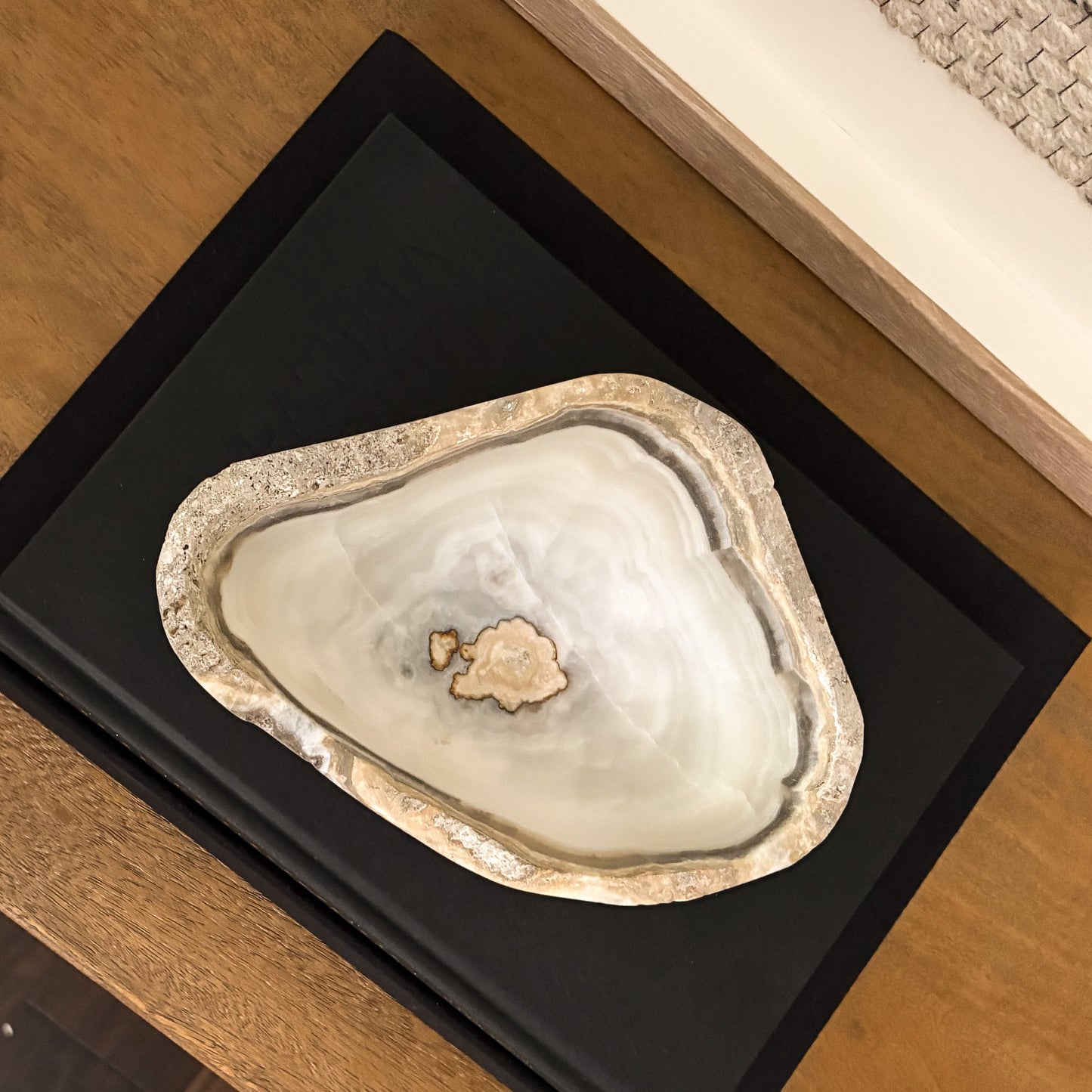Small grey onyx bowl featuring natural veining and hand carved craftsmanship for elegant home décor