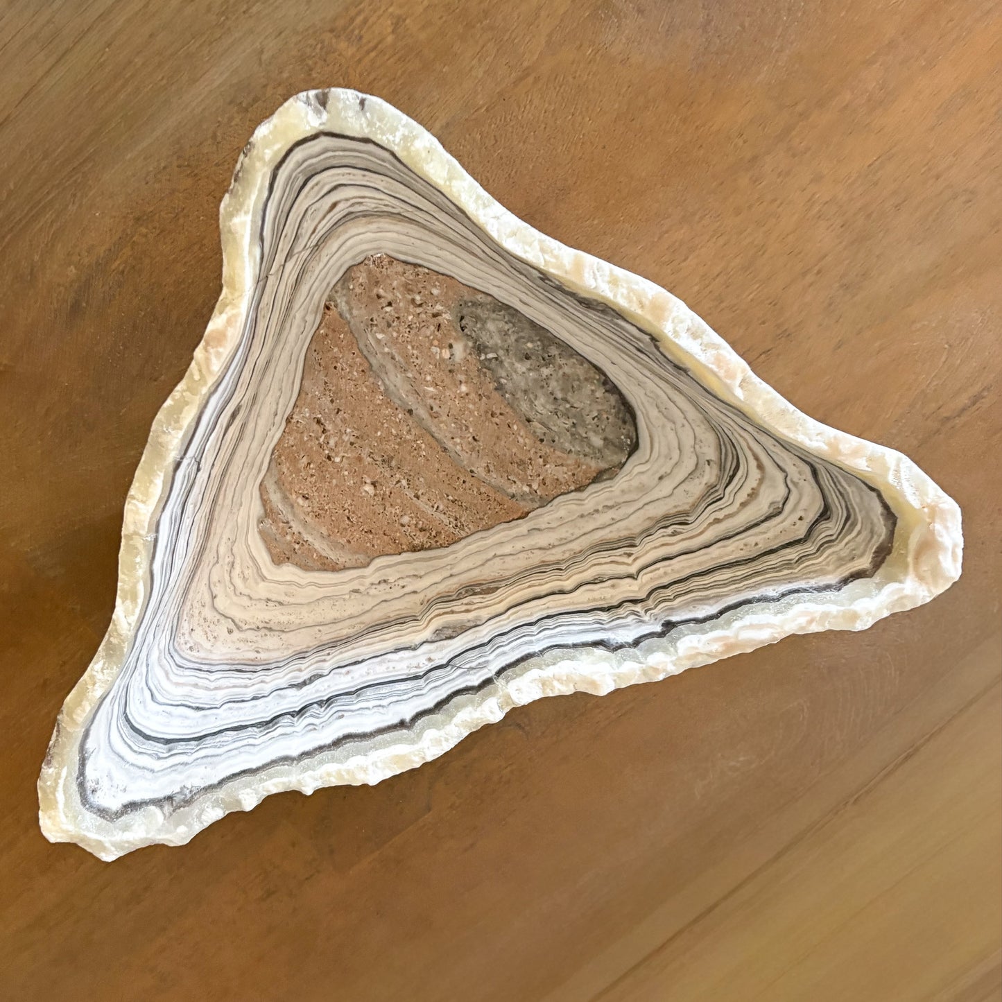 Luxury natural stone zebra onyx bowl displayed as modern sculptural home decor