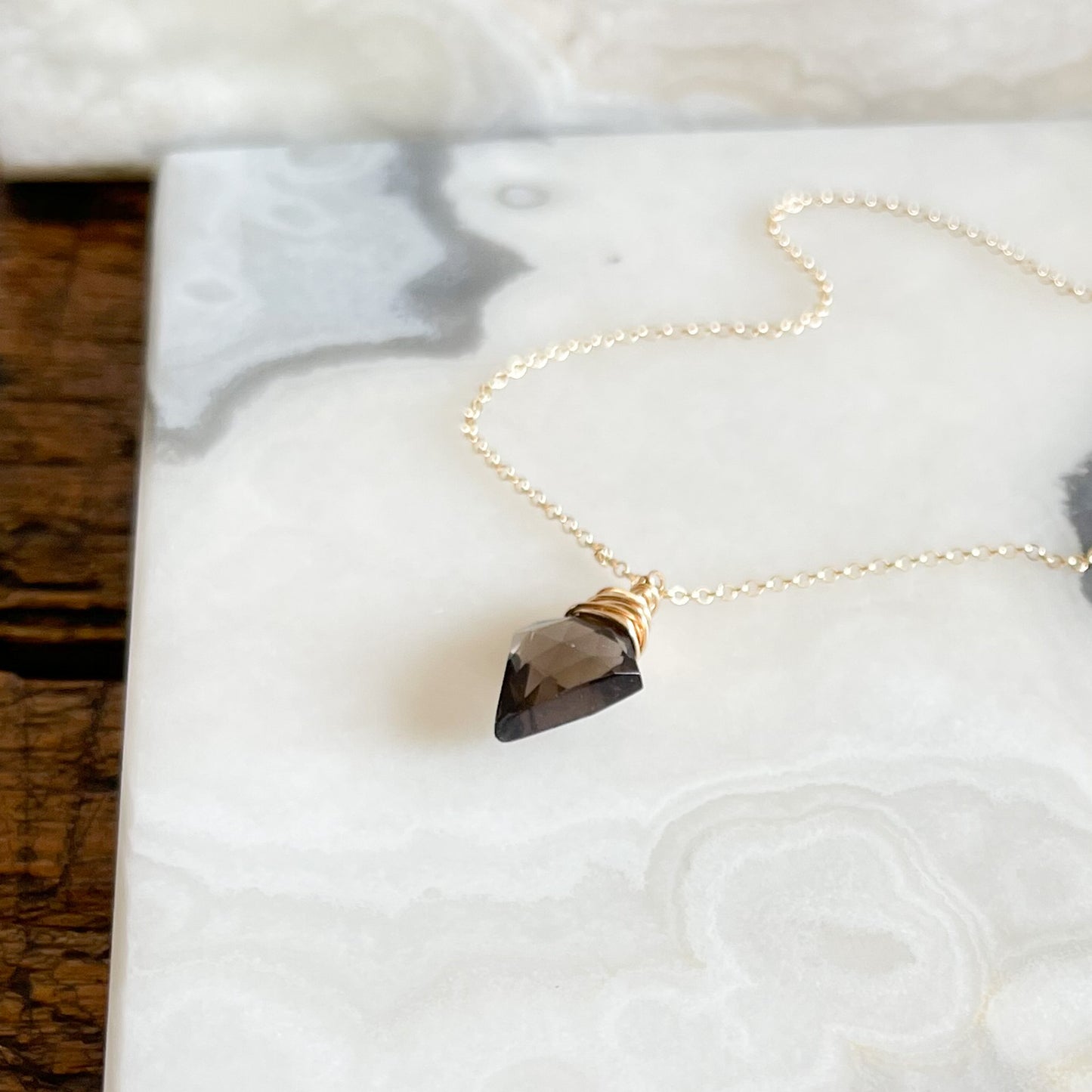 Gold necklace with smoky quartz arrow pendant
