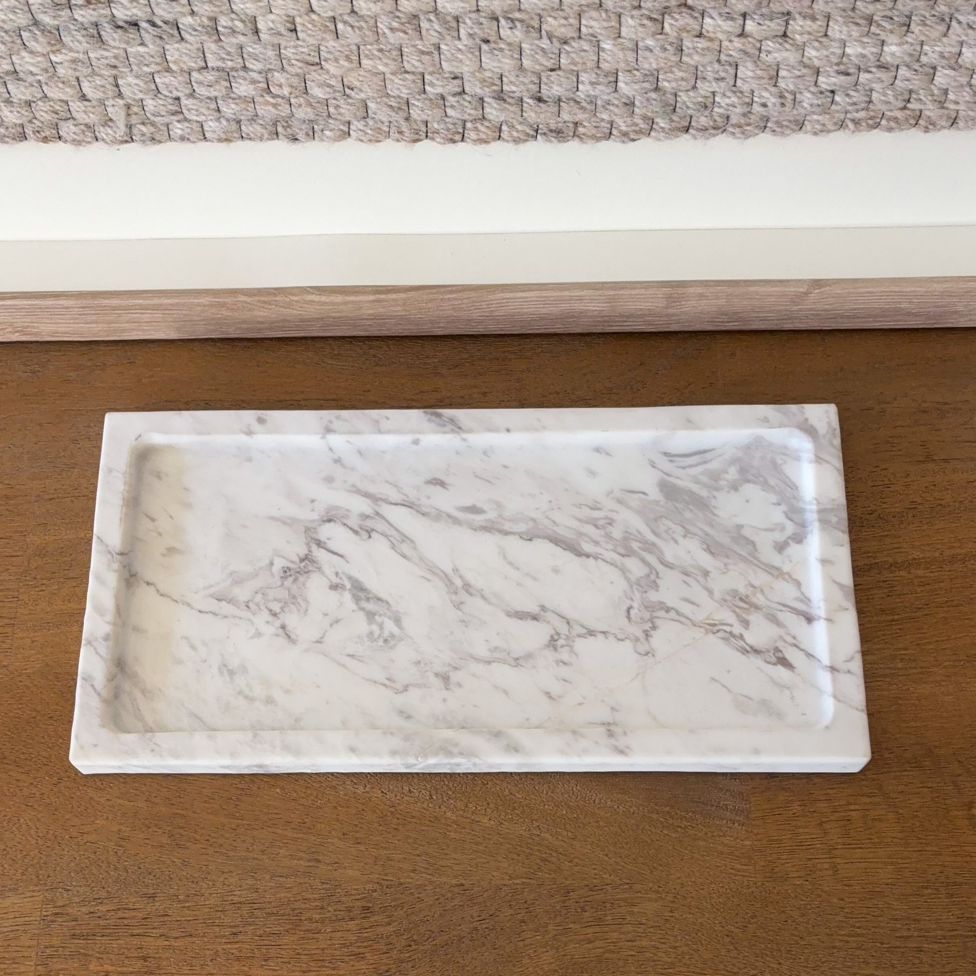 Minimalist white marble tray on wooden console table