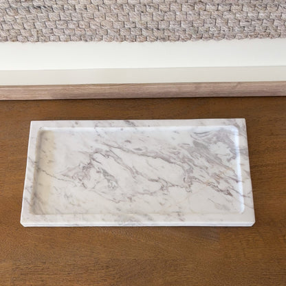 Minimalist white marble tray on wooden console table