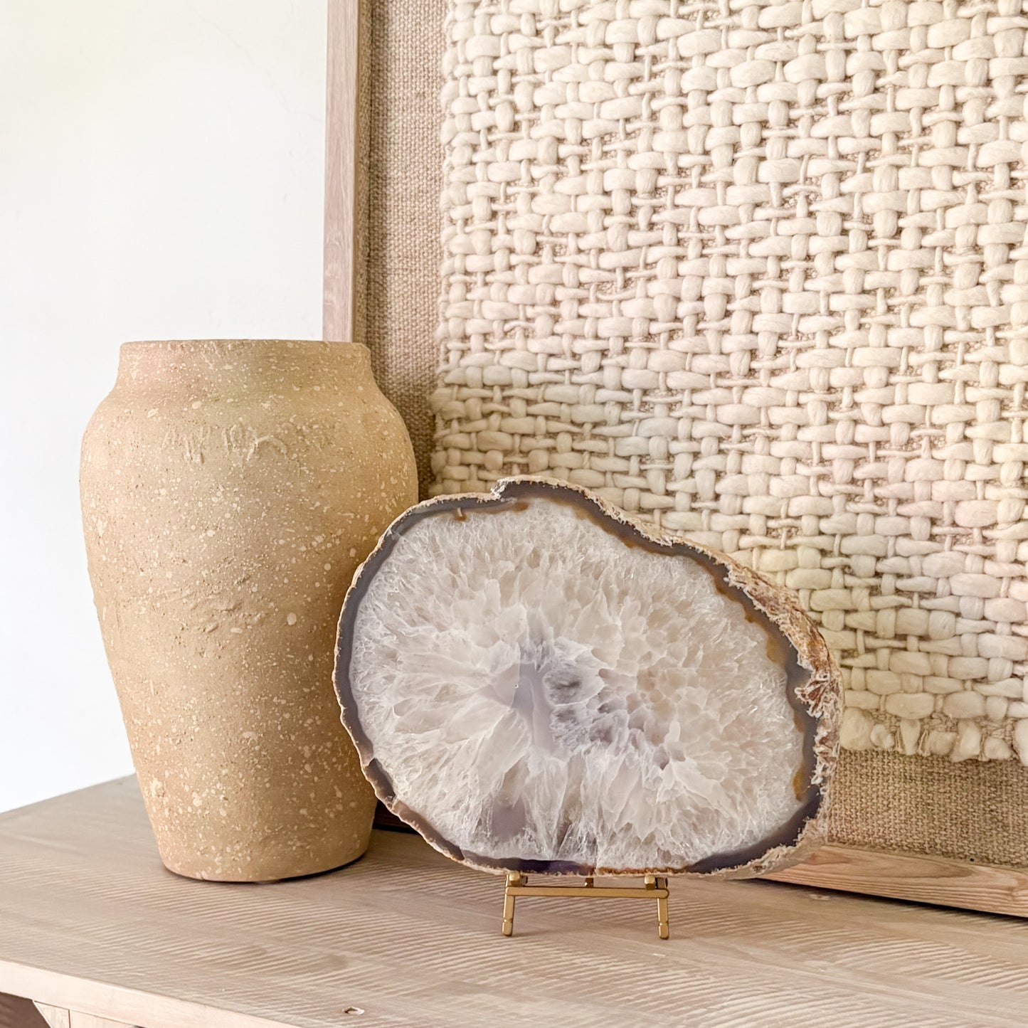 Natural Brazilian agate slice on stand with polished surface and unique mineral banding