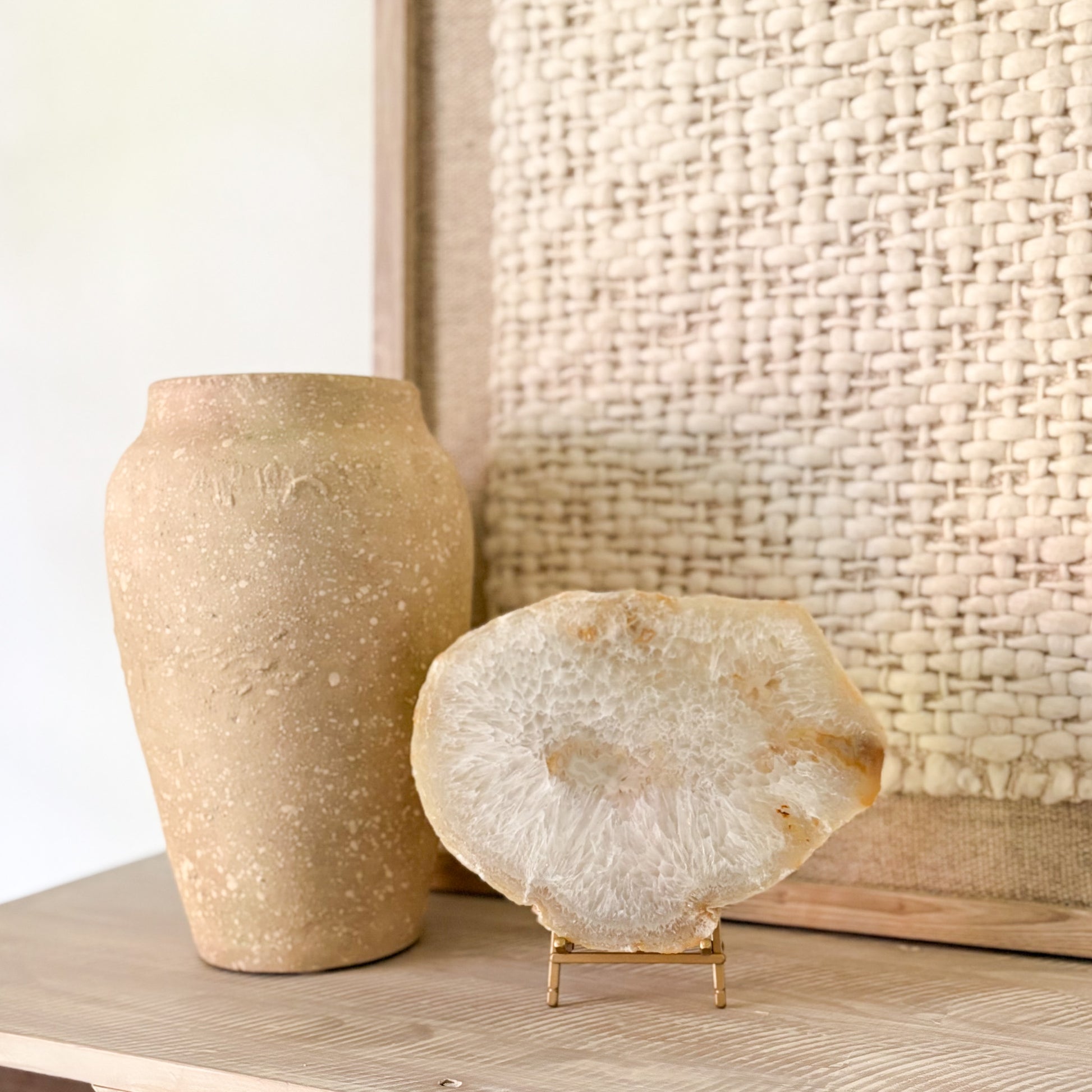 Decorative Brazilian agate crystal slab on stand with natural geode patterns