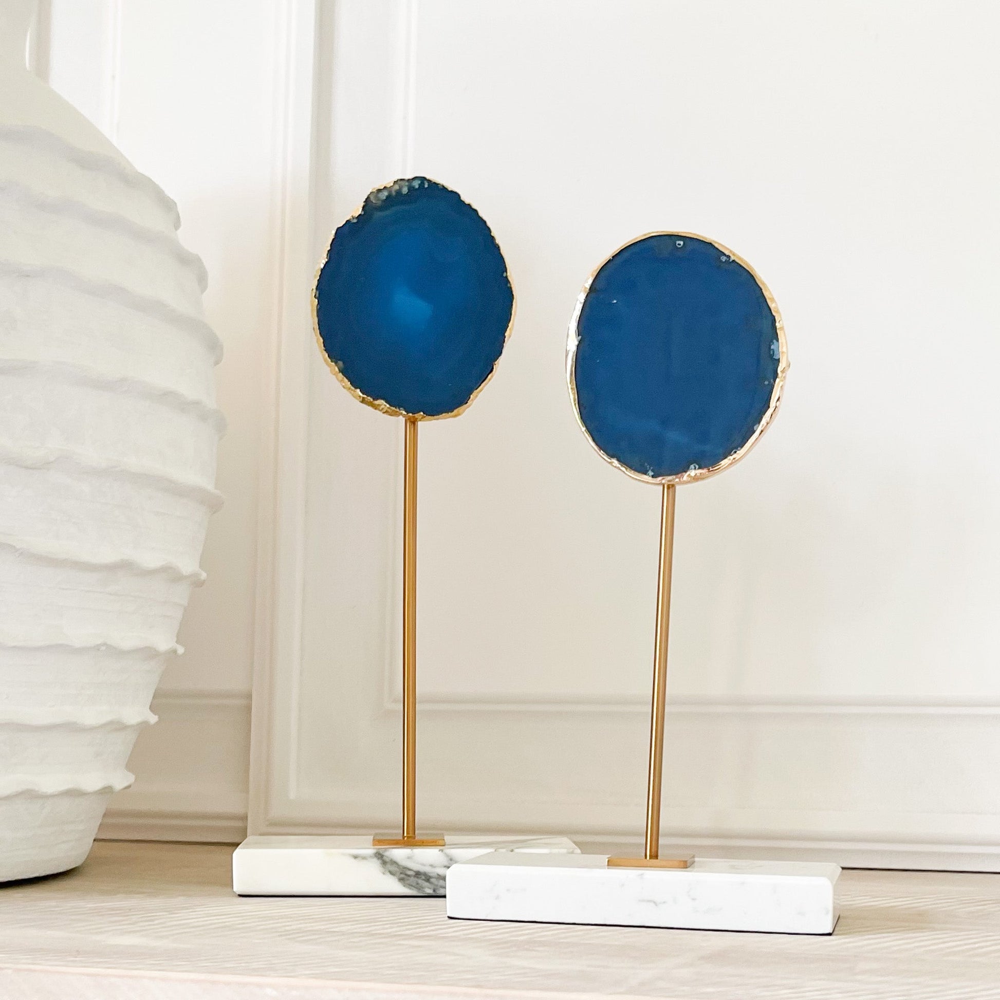blue agate slice on marble and brass stand