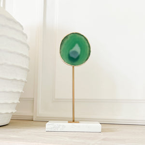Open image in slideshow, green agate silce on marble and brass stand
