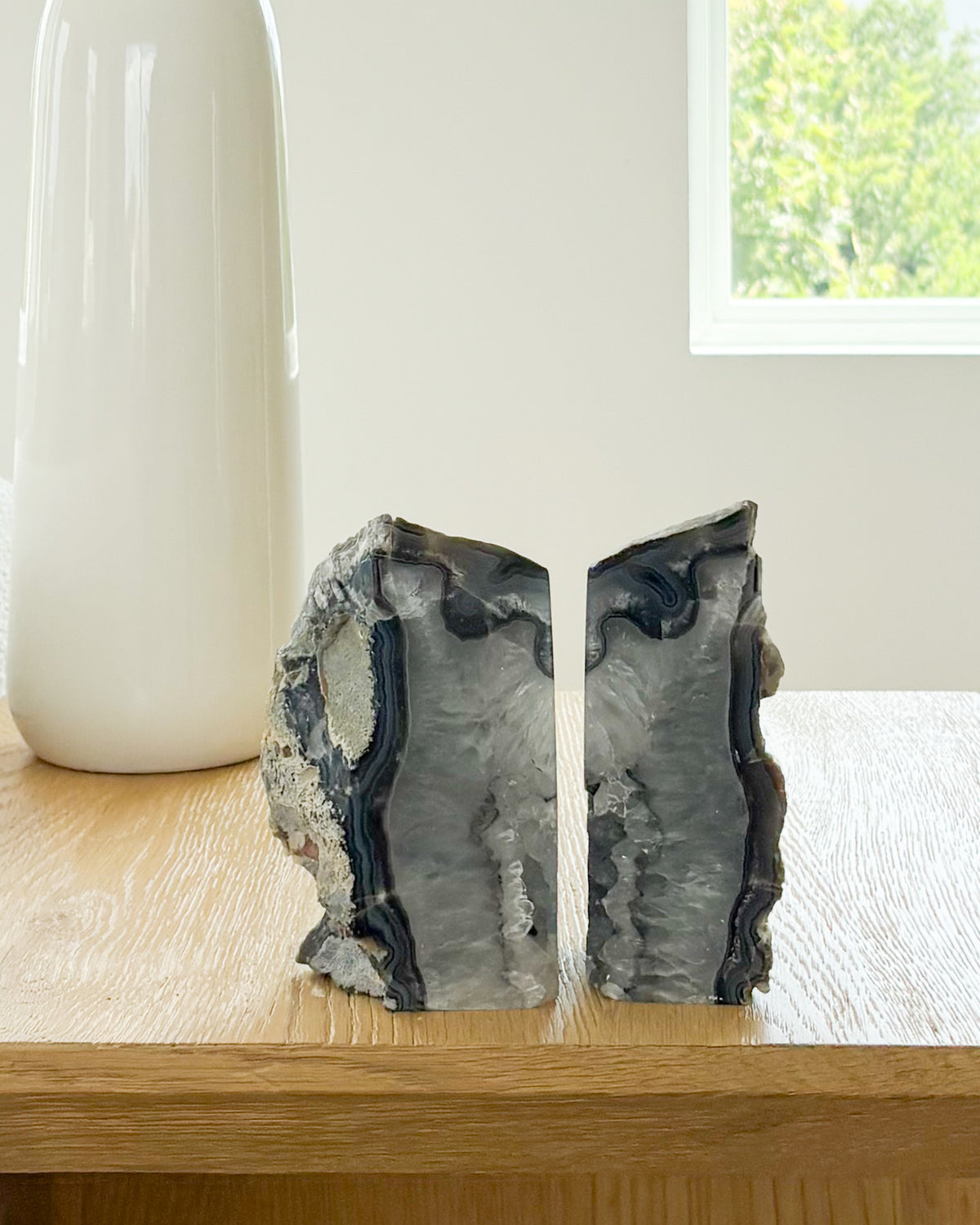 Polished agate bookend pair with raw druzy crystal