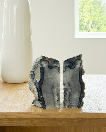 Polished agate bookend pair with raw druzy crystal