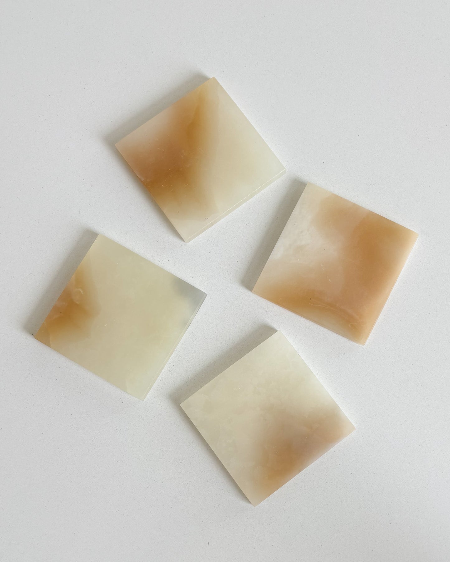 square amber onyx stone coasters with organic veining