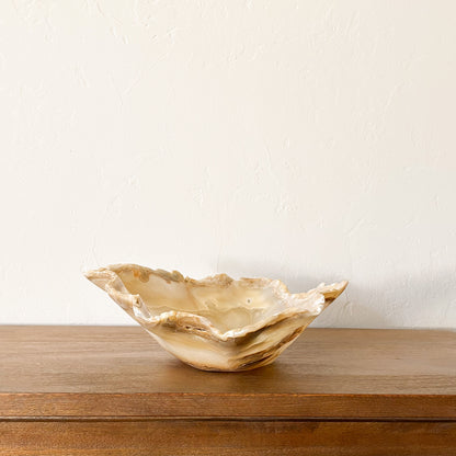 Luxury hand carved amber onyx bowl in warm honey and cream tones