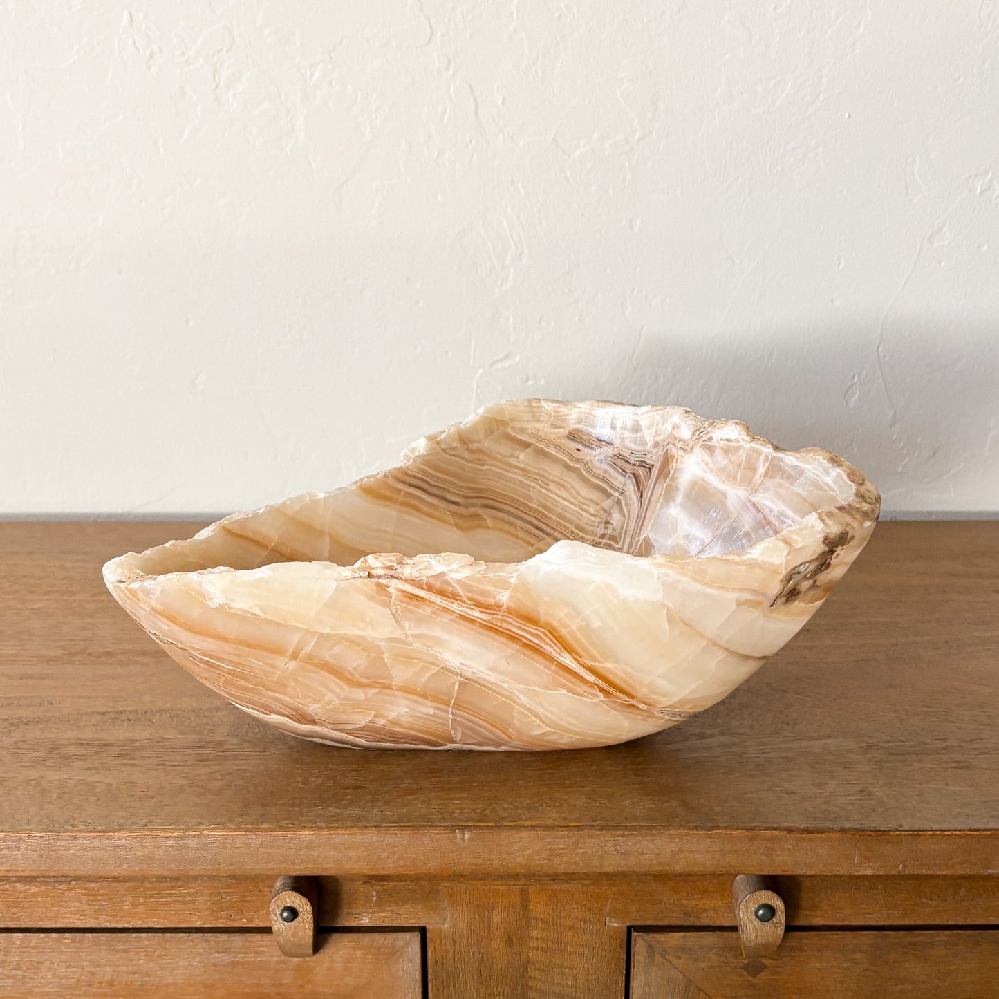 Decorative amber onyx centerpiece bowl in warm honey and cream tones
