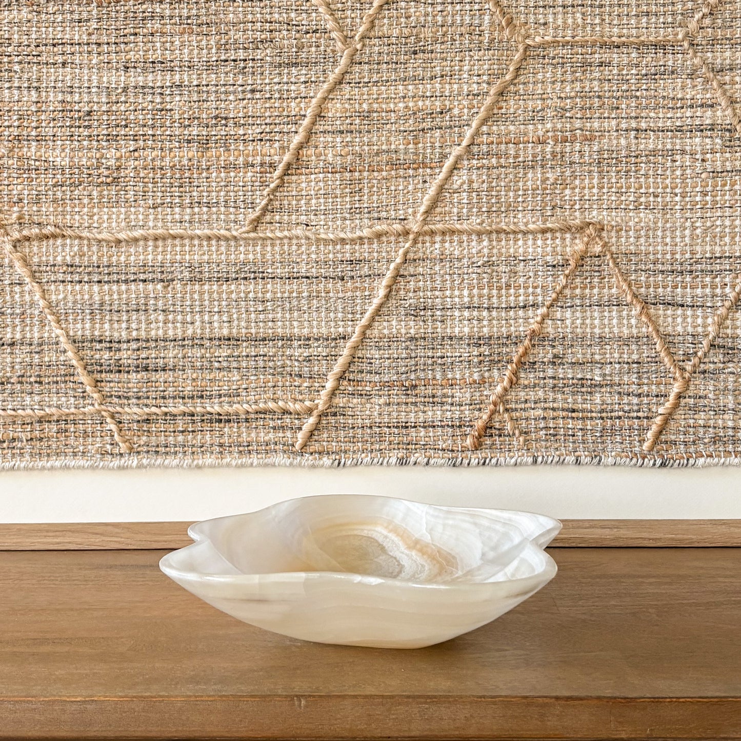 Organic shaped hand carved onyx bowl with natural veining