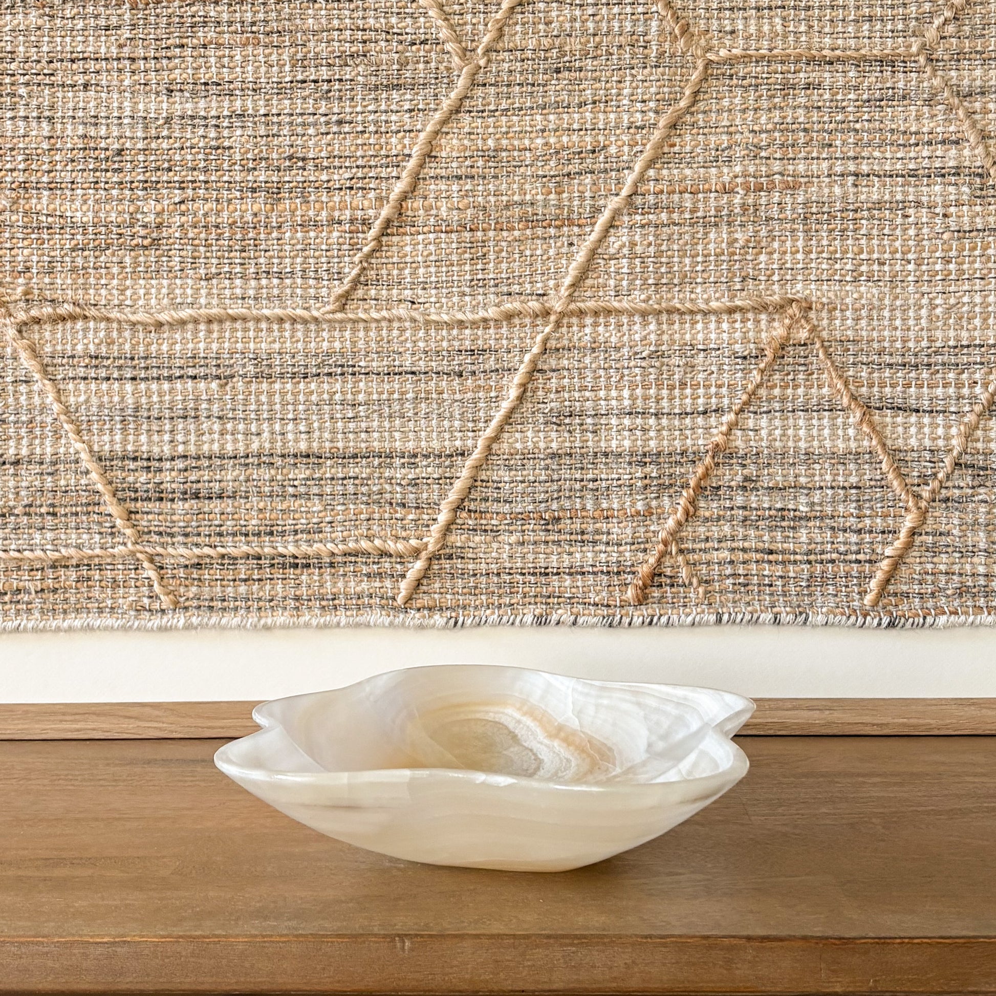 Organic shaped hand carved onyx bowl with natural veining