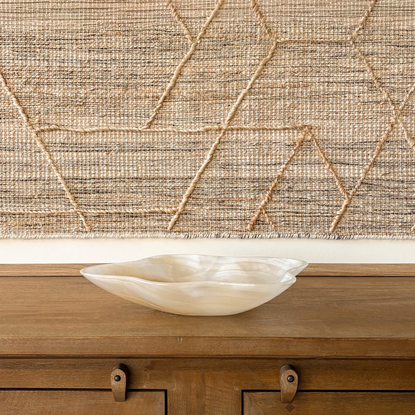 Hand carved onyx stone bowl in warm amber and cream tones