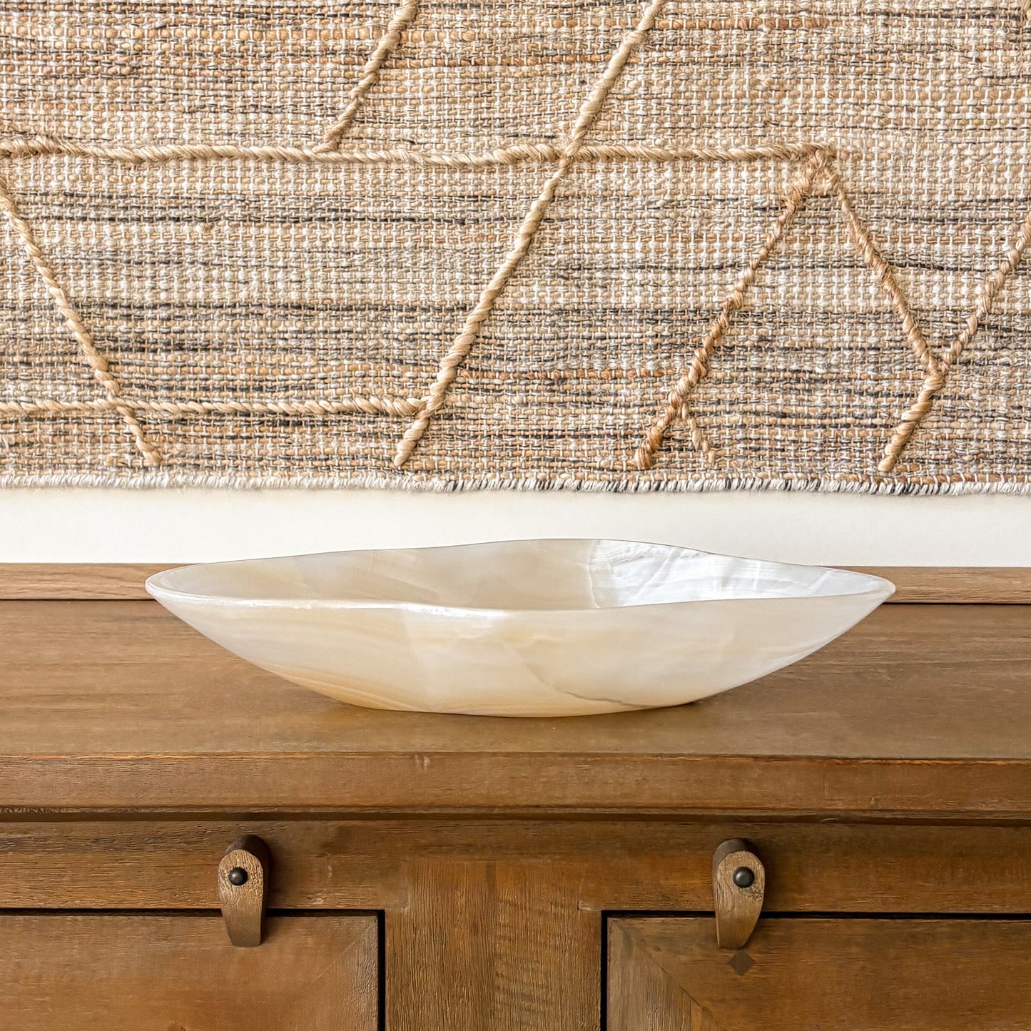 Amber onyx centerpiece bowl styled on wooden console table
