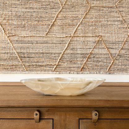 Hand carved onyx stone bowl in warm amber and cream tones