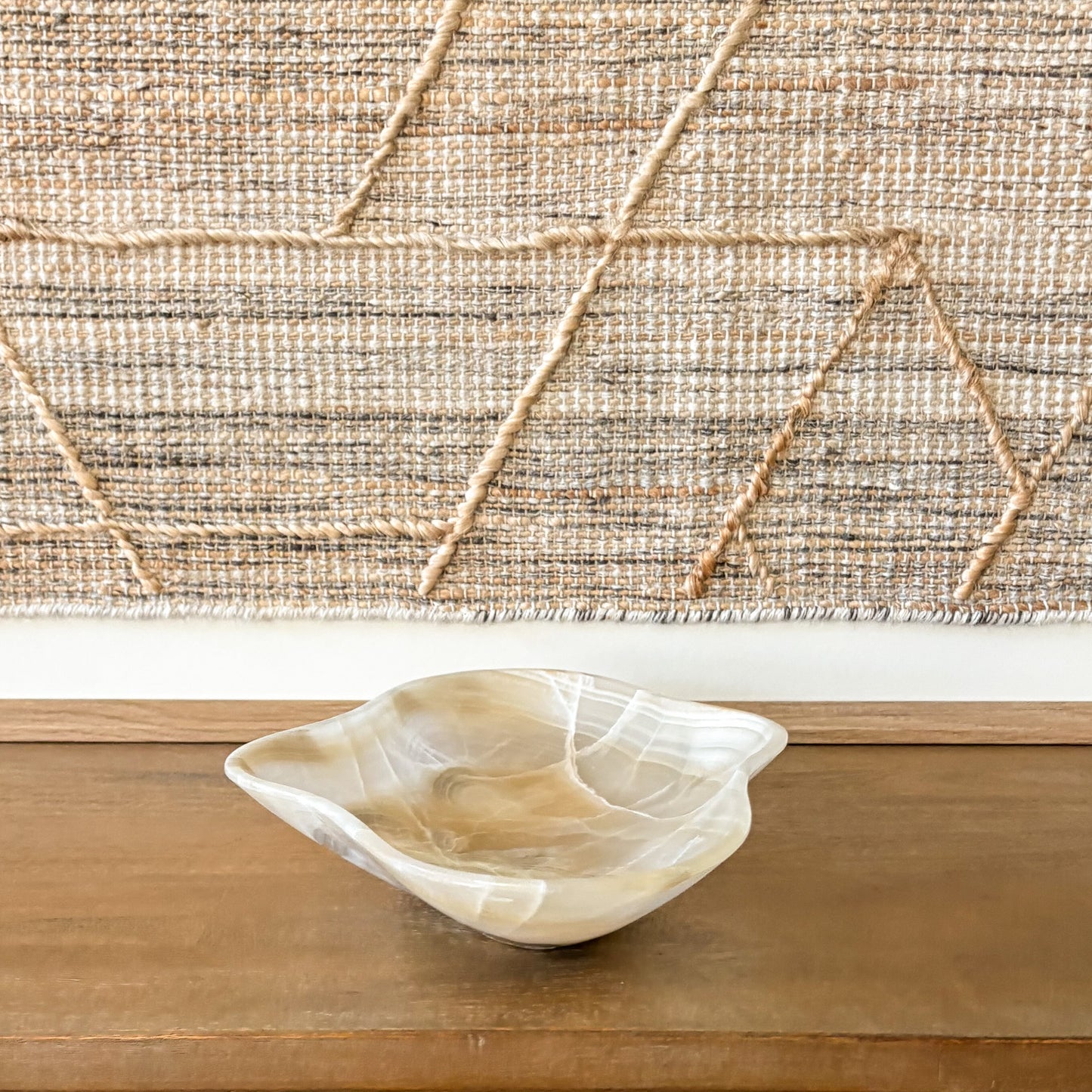 Amber onyx centerpiece bowl styled on wooden console table