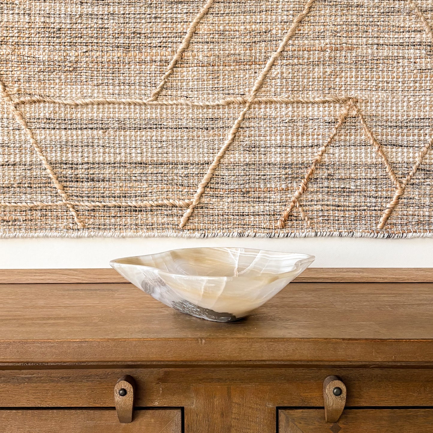 Organic shaped hand carved onyx bowl with natural veining