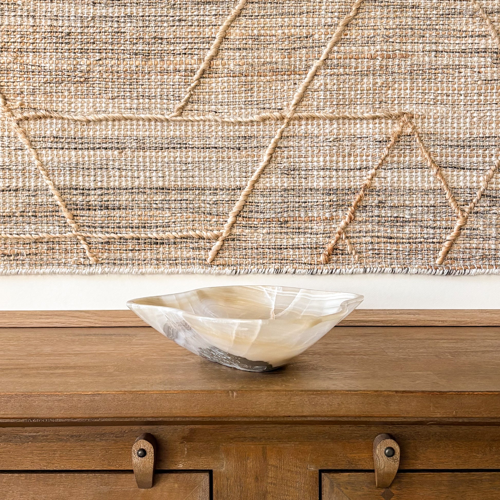 Organic shaped hand carved onyx bowl with natural veining