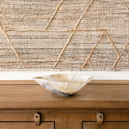 Organic shaped hand carved onyx bowl with natural veining