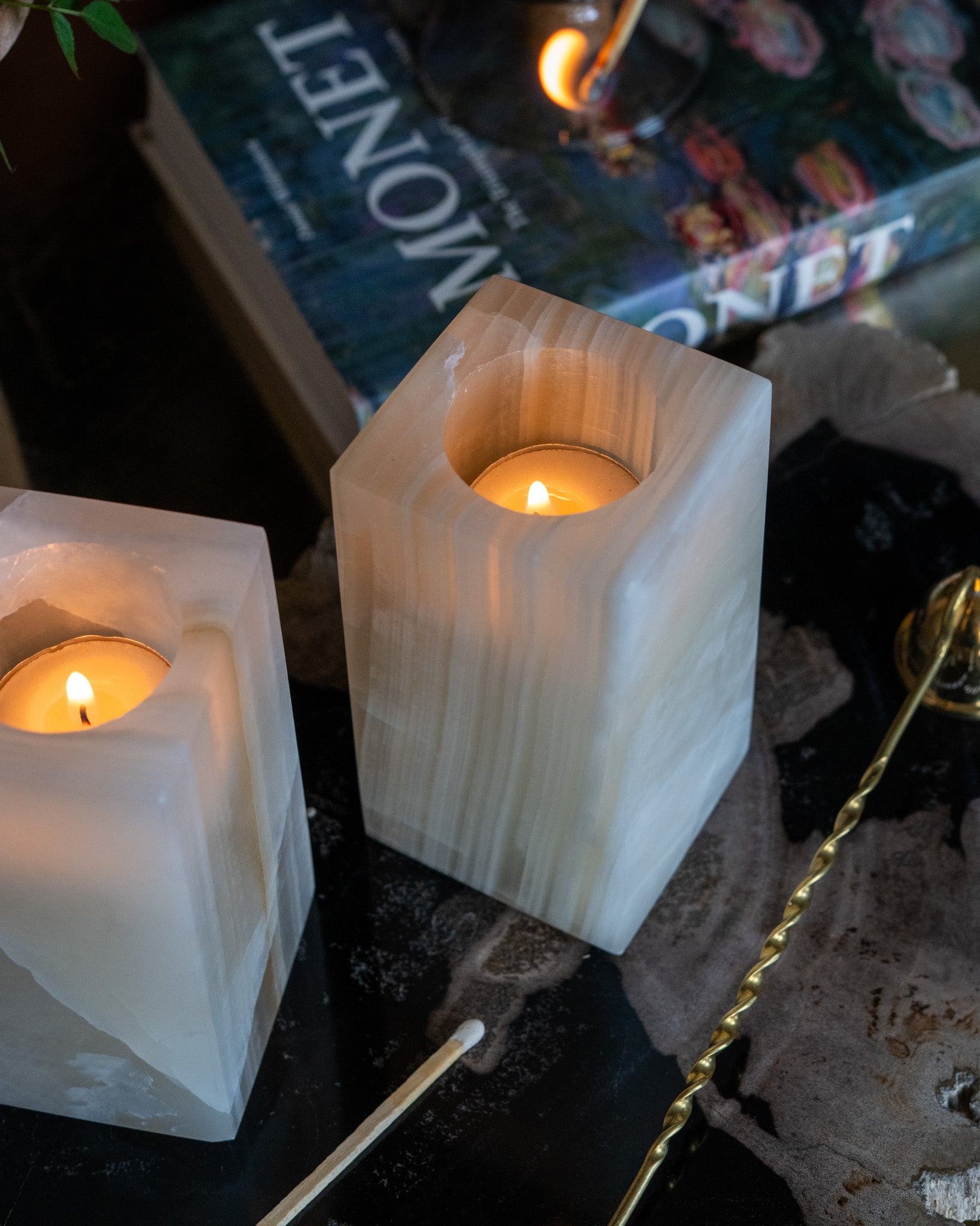 Handcrafted amber onyx candle holder featuring warm honey-colored tones