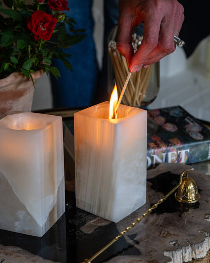 Artisan-crafted amber onyx votive candle holder for elegant décor