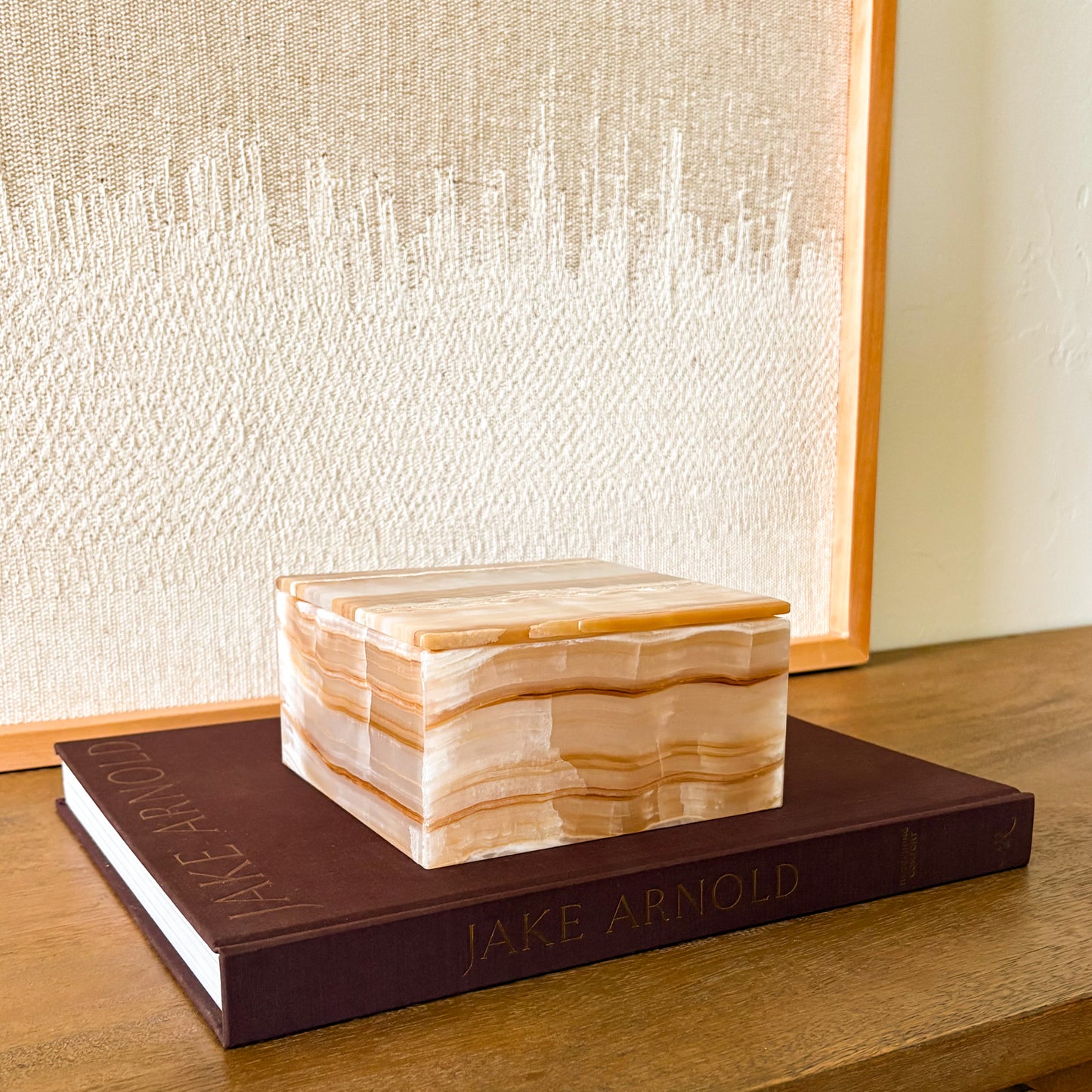 Natural amber onyx decorative storage box styled on coffee table books