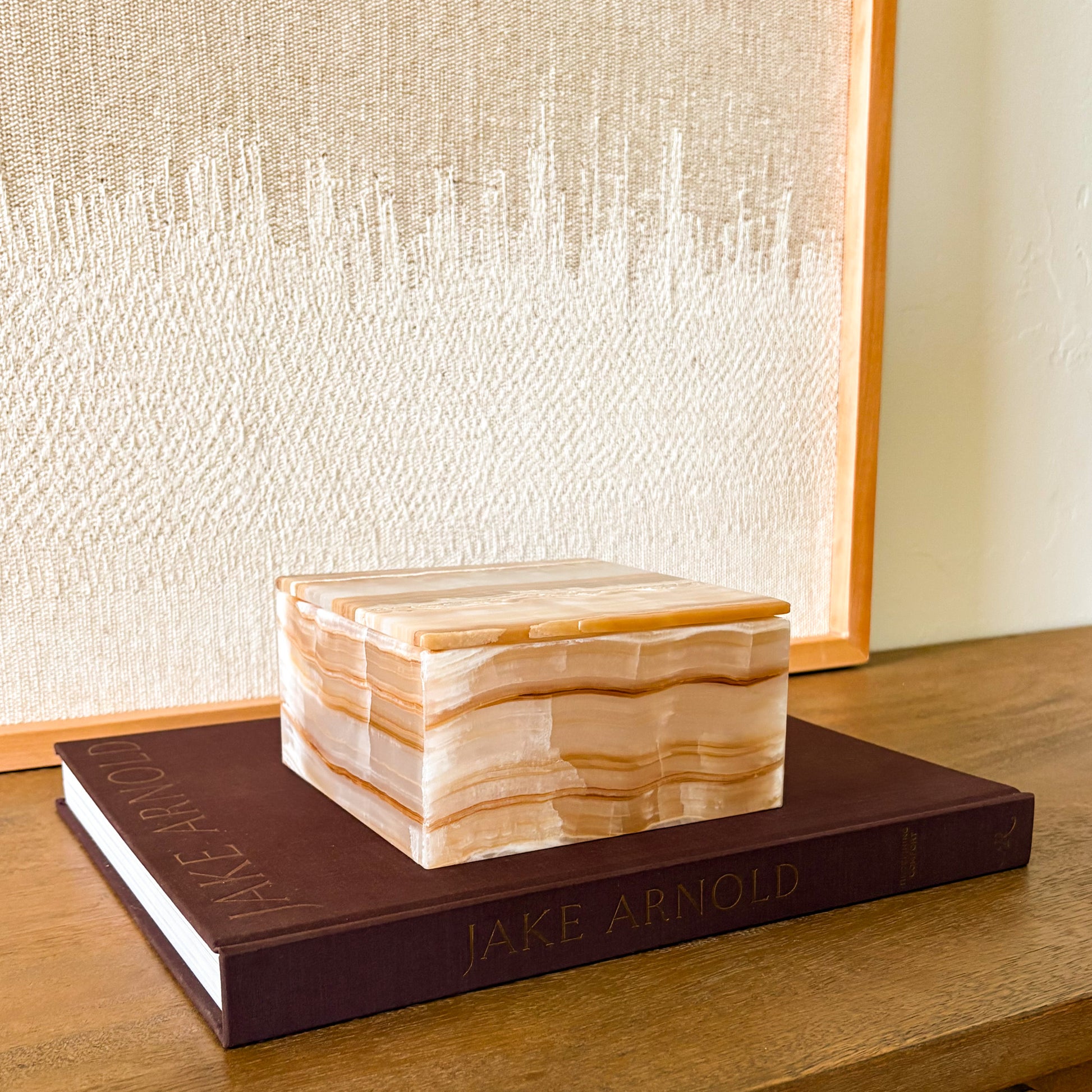 Natural amber onyx decorative storage box styled on coffee table books