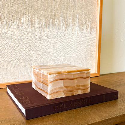 Natural amber onyx decorative storage box styled on coffee table books