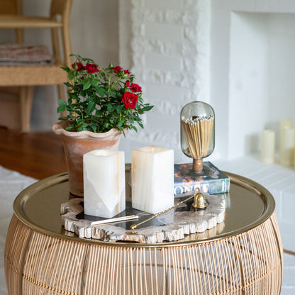 Handcrafted stone tealight candle holders on modern gold accent table