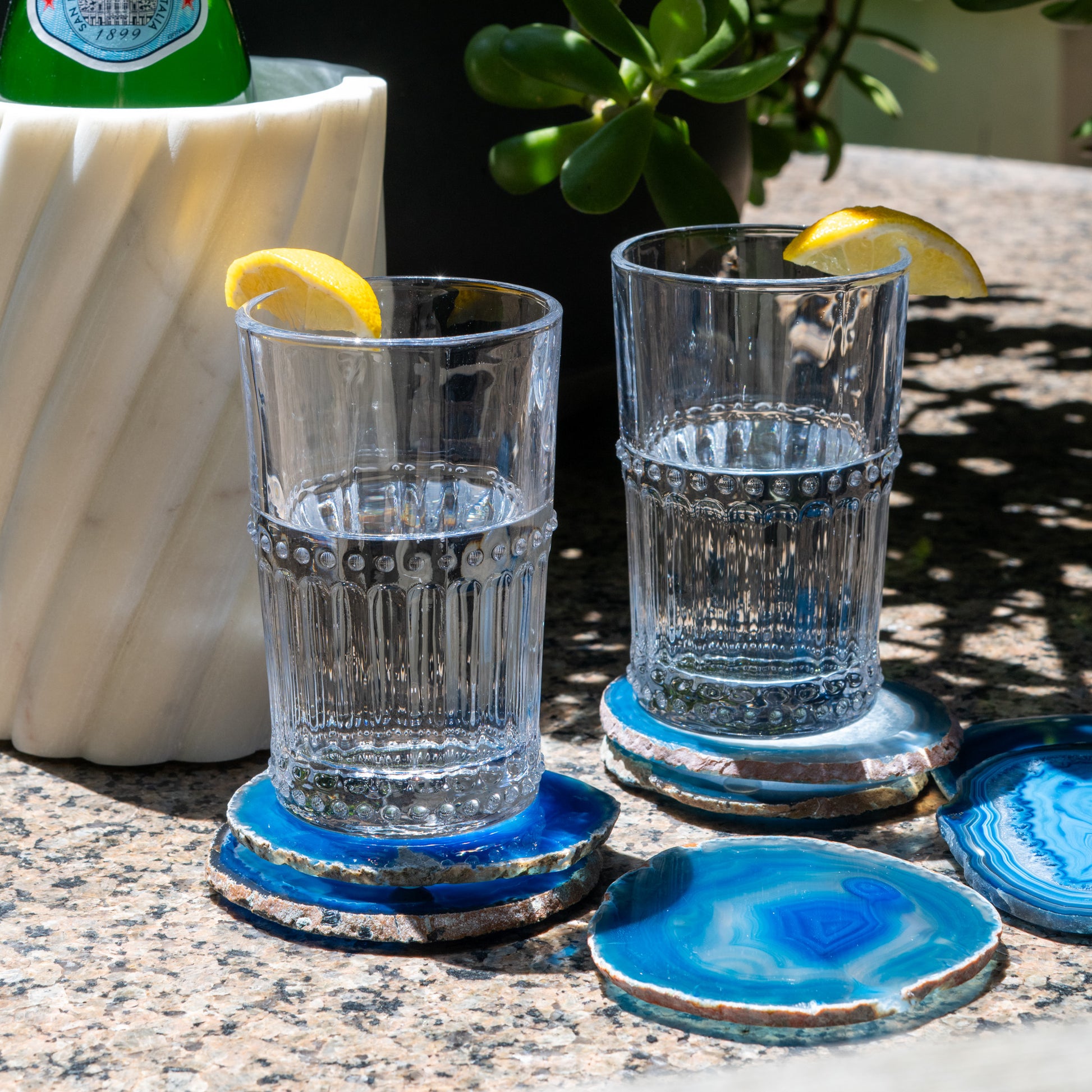 Vibrant blue agate coaster set crafted from genuine Brazilian agate with polished edges and natural crystal details.