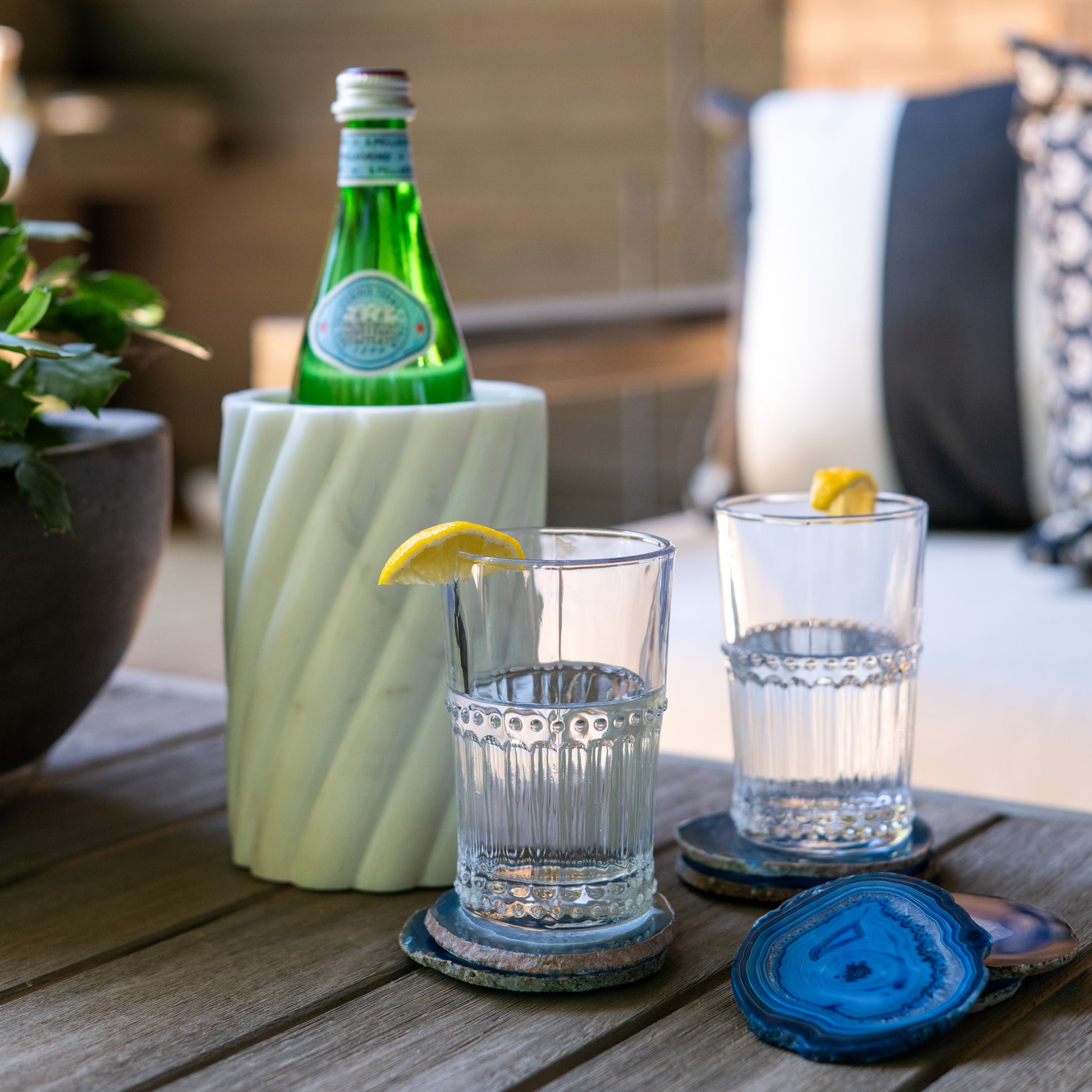Vibrant blue Brazilian agate coaster set with natural stone banding and polished finish for luxury home décor.