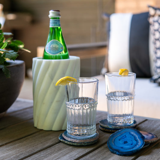 Vibrant blue Brazilian agate coaster set with natural stone banding and polished finish for luxury home décor.