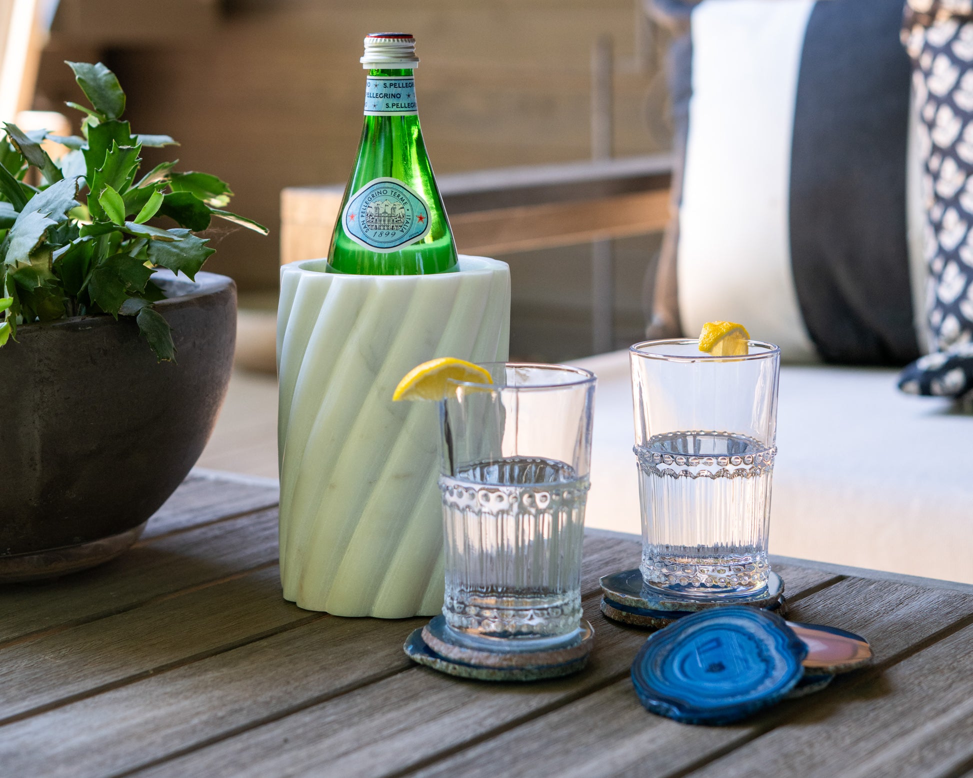 Vibrant blue Brazilian agate coaster set with natural stone banding and polished finish for luxury home décor.