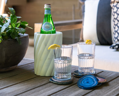 Vibrant blue Brazilian agate coaster set with natural stone banding and polished finish for luxury home décor.