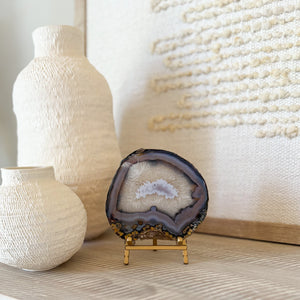 blue, white and grey brazilian agate slice on brass easel stand