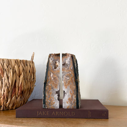 Brazilian agate geode bookends with amber banding and white quartz crystal center